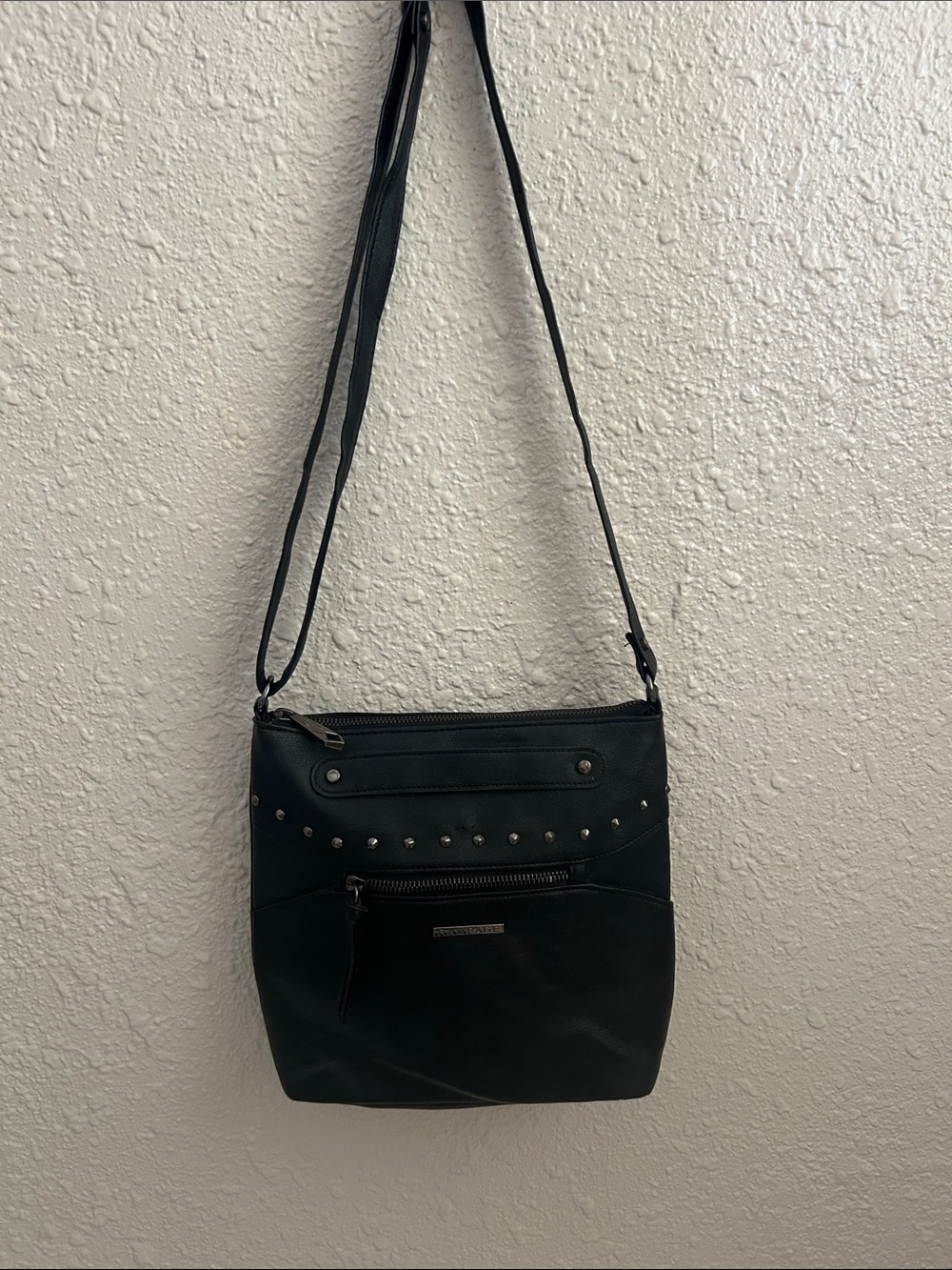 This Rampage black faux leather crossbody bag, which bears the RN#149273